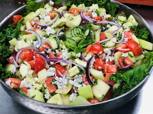 salad with cucumber, red onion, tomato and blue cheese