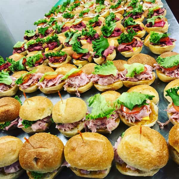rows of sandwiches with meat and lettuce