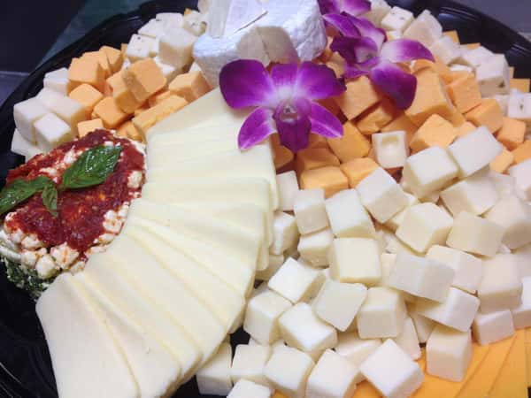 a tray of assorted cheeses