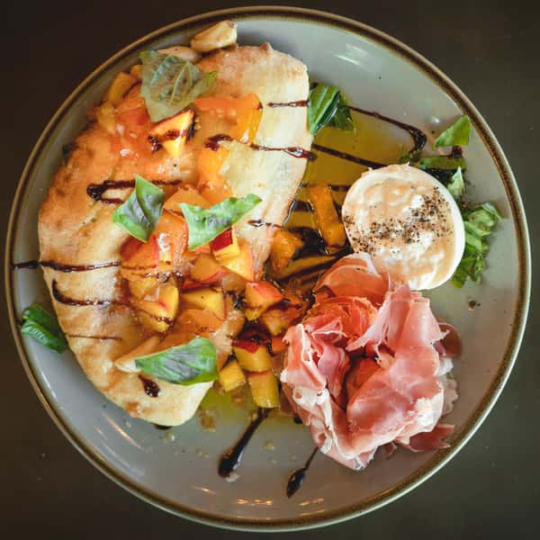 Top view photo of a light breakfast meal served with sides