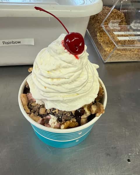 Ice-cream with nuts and a cherry on top