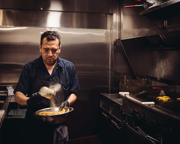 Chef seasoning French fries