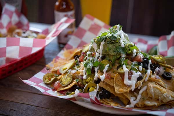 Nachos piled high with guacamole