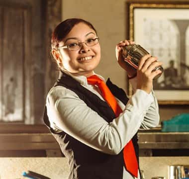 hostess holding cocktail shaker