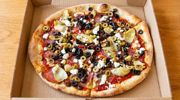 Pizza with pepperoni, black olives, green olives, artichoke hearts, and feta cheese.