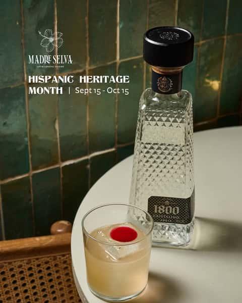 Herencia cocktail next to a bottle of 1800 Cristalino Tequila at Madre Selva for Hispanic Heritage Month, Sept 15 to Oct 15