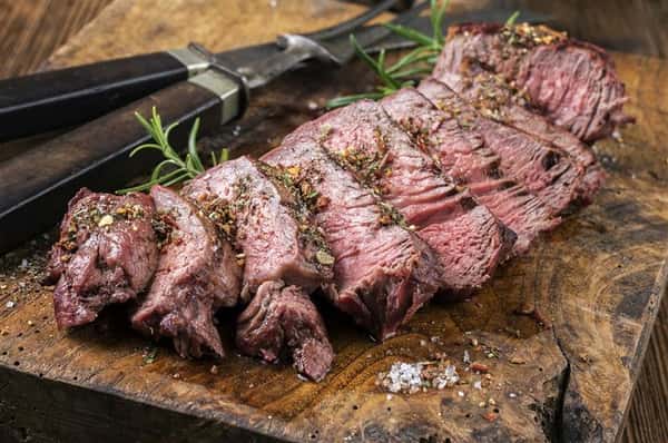 cut steak on cutting board