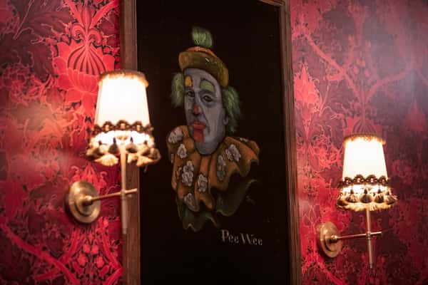 clown painting in interior of club 616