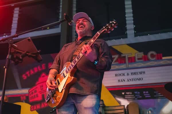 Live band performing on stage while guests dine and watch the show in Orlando, FL