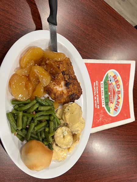 Chicken dinner with green beans, potatoes and a roll