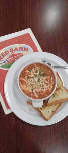 Tomato soup with grated cheese and toast