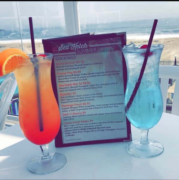 drink menu and two tropical beverages