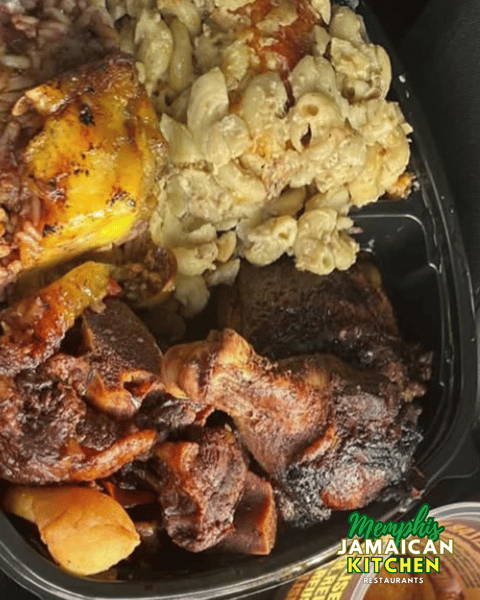 Jerk chicken, curry chicken, mac and cheese, and rice and peas from Memphis Jamaican Kitchen.