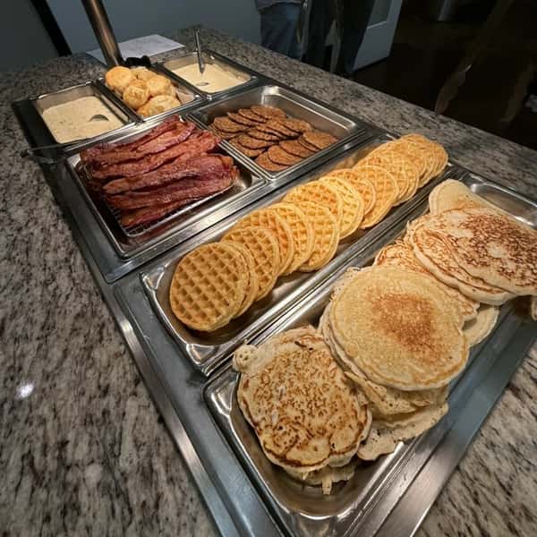 Waffles, pancakes, and bacon from the buffet