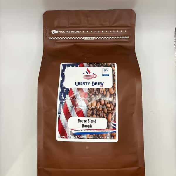 Bag of Liberty Brew's House Blend Hooah coffee, featuring patriotic packaging with roasted coffee beans and the American flag design.