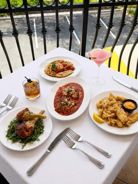 Dining table with entrees and drinks