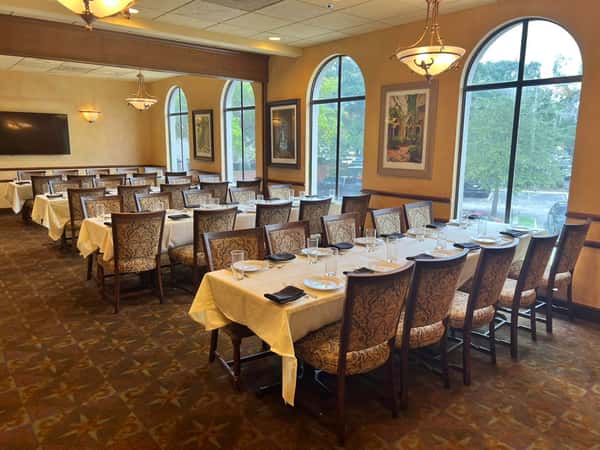 Upstairs dining area with large windows at Antonio's Maitland