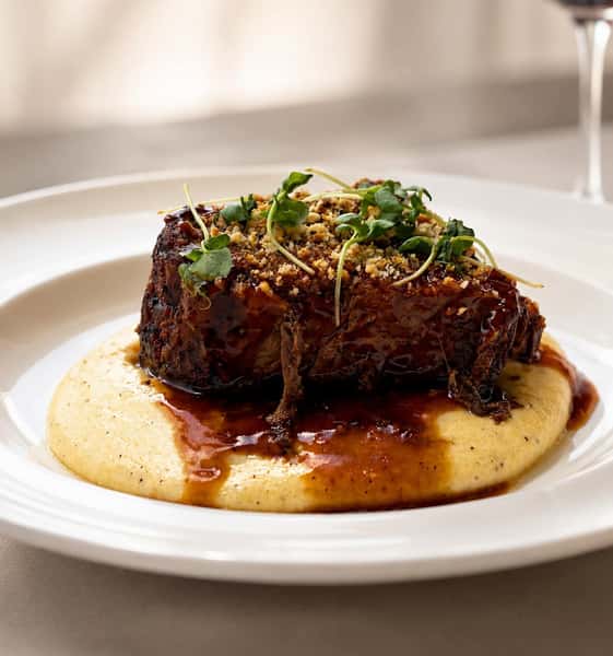 Beef served over mashed potatoes