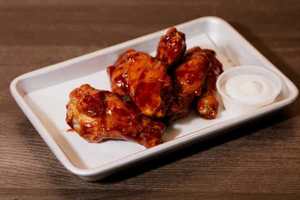 A plate of crispy chicken wings