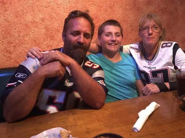 three people posing for picture