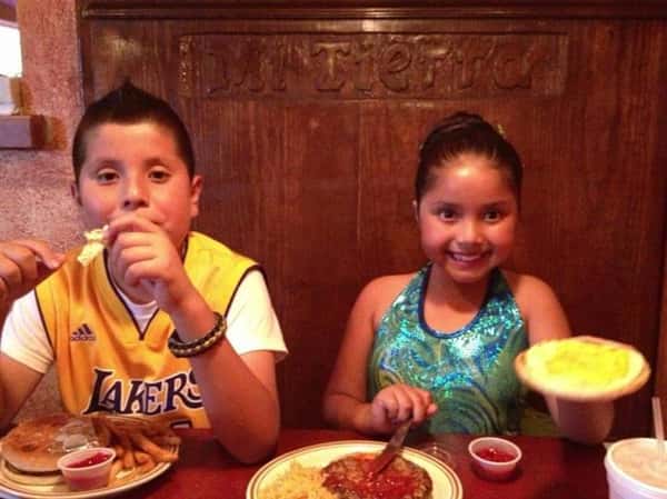 two kids smiling for picture