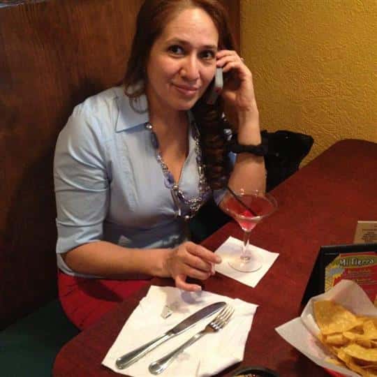 female talking on a phone posing for picture