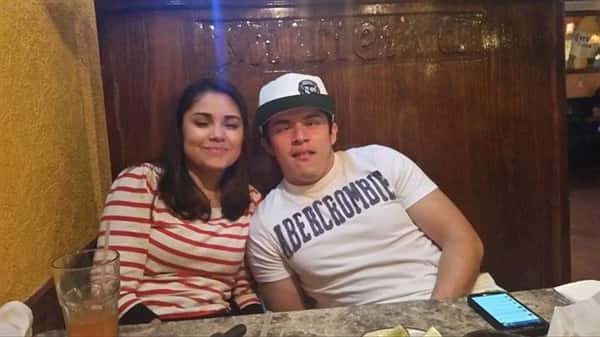 two people posing for picture