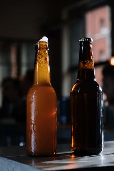 two long neck bottles of bber