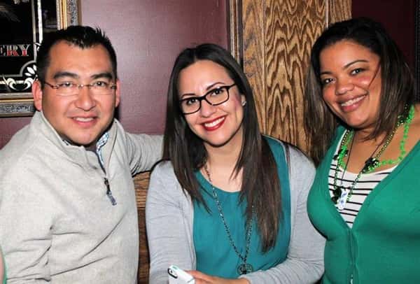 Three people smiling in photo