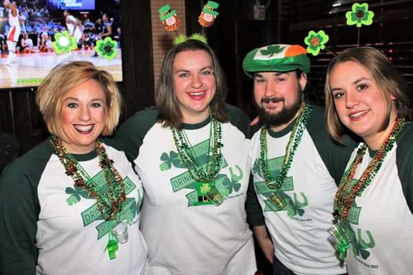 Four people dressed up for st. patrick's day