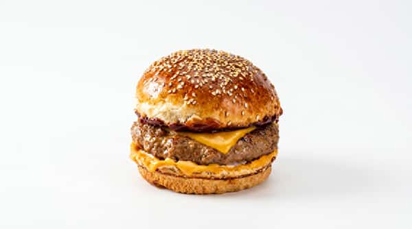 Cheeseburger with a beef patty, melted yellow cheese, and sesame seed bun.