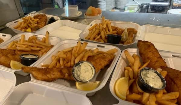 several containers of fish with french fries