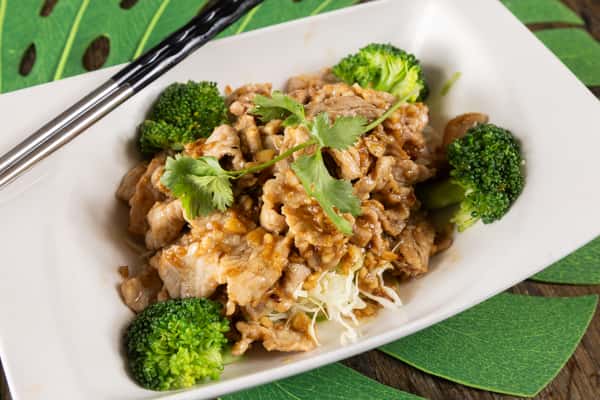 Thai fried rice stir-fried with tender chicken, fresh vegetables, and aromatic herbs, finished with savory seasoning for a comforting and flavorful authentic Thai classic.