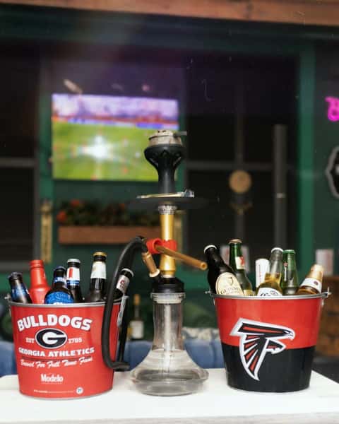 Hookah and cocktails at Sivas Tavern sports lounge with TVs, nightlife vibes, and relaxed bar atmosphere