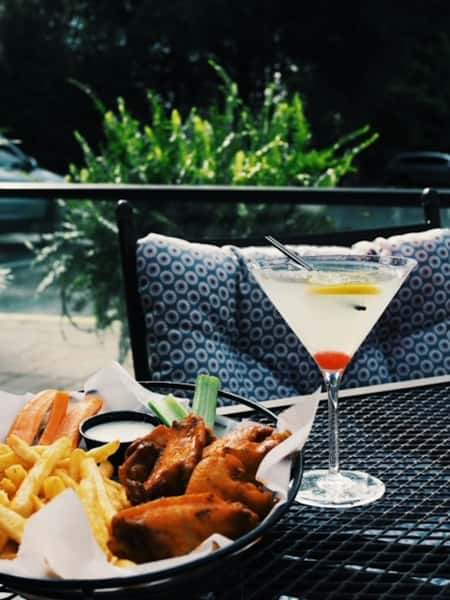 Martini and seafood platter at Sivas Tavern featuring upscale patio dining and cocktail lounge vibes