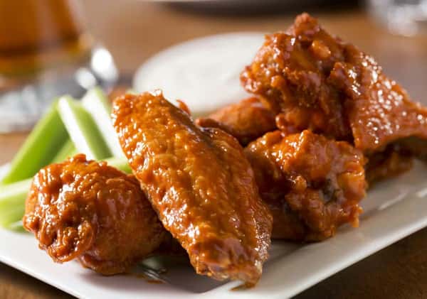 Buffalo chicken wings with celery at Sivas Tavern featuring flavorful bar food and casual dining atmosphere