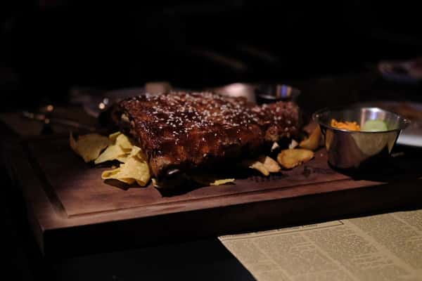 Barbecue ribs plated at Sivas Tavern featuring hearty Southern-inspired dining and smoky flavors