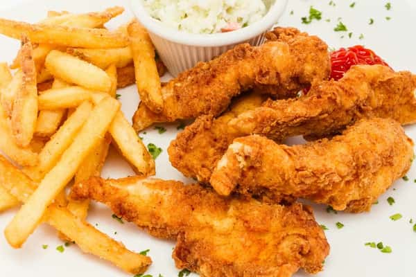 Chicken tenders with french fries and coleslaw at Sivas Tavern featuring classic comfort food dining