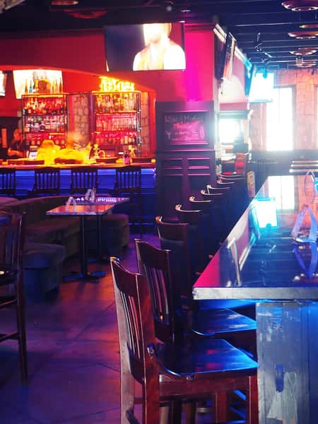 Colorful bar interior at Sivas Tavern with vibrant lighting and upscale nightlife atmosphere
