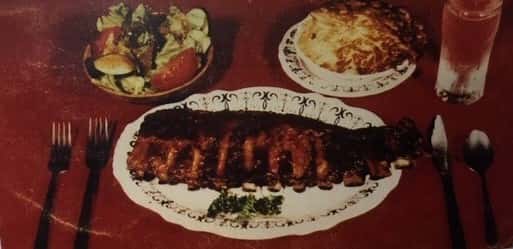 plate of ribs with two plates of sides
