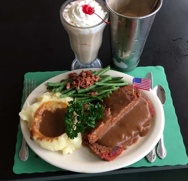 meatloaf and mashed potatoes with gravy and a chocolate shake