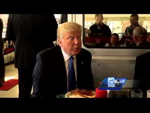 Donald Trump eating at table