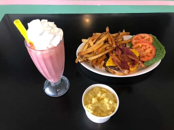 bacon cheeseburger with side of fries and strawberry shake
