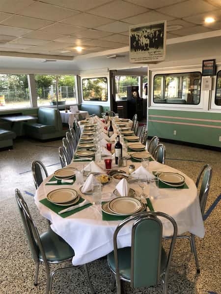 three tables combined together, arranged for a party