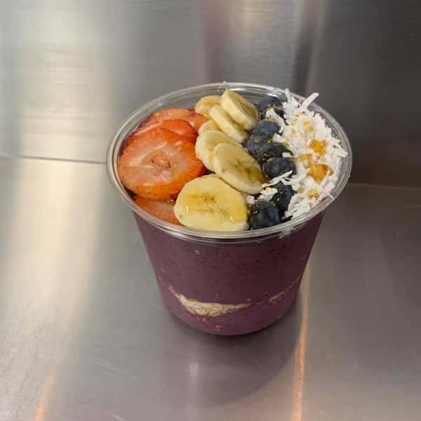 acai bowl with fruit and coconut on top