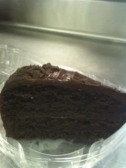 Slice of chocolate cake with chocolate icing