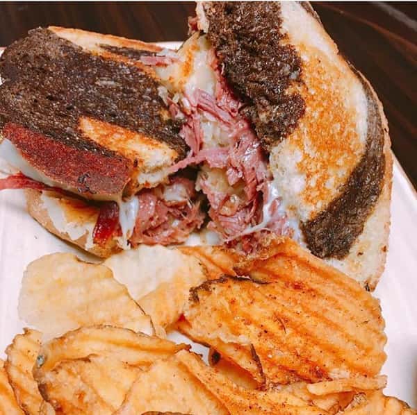 reuben sandwich with a side of fries