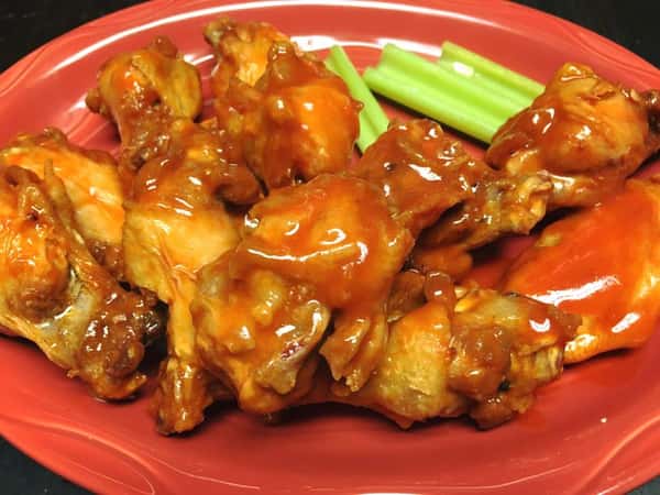 buffalo wings with sauce on a plate