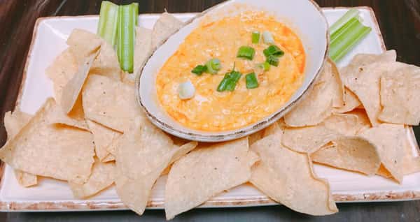 chips and cheese dip on a plate