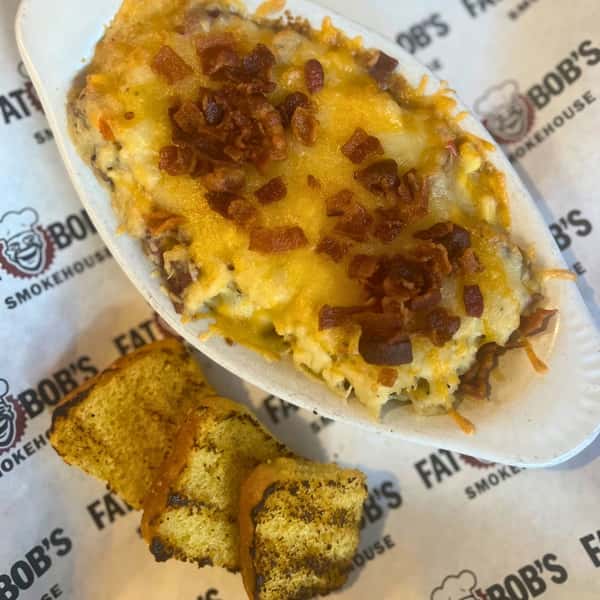 Stay warm with BBQ layers! Try the Brisket Shepherd's Pie this month only! Layered brisket, Cajun corn + gravy atop a bed of loaded mashed potatoes.

fatbobs.com - #limitedtime
#planyourvisit